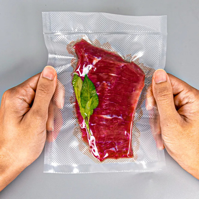 Venda a retalho Bolsa de embalagem de vácuo de compressão impressa à medida Bolsa de plástico de vedação de vácuo para alimentos